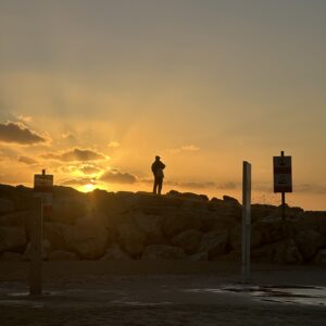Traveler on Tel Aviv's Coastline Glass (Portrait)